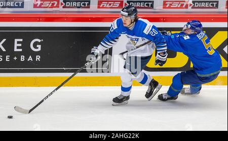 Trinec, Czech Republic. 29th Dec, 2019. L-R Matias Maccelli (FIN) and Oleg Boiko (KAZ) in action during the 2020 IIHF World Junior Ice Hockey Championships Group A match between Kazakhstan and Finland in Trinec, Czech Republic, on December 29, 2019. Credit: Vladimir Prycek/CTK Photo/Alamy Live News Stock Photo