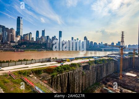 High-rise buildings and construction sites along the Yangtze River in Chongqing Stock Photo