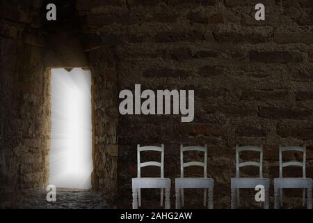 Chairs for waiting. Mystical passage to eternity. Collage concept. Ancient masonry in a dark room with a luminous opening. Stock Photo