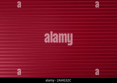 Red ribbed metallic surface close up. Texture and background Stock Photo