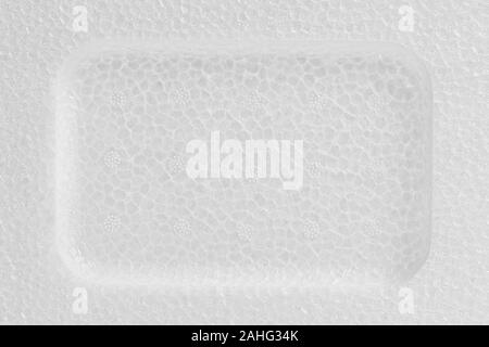 White Styrofoam with deepening within close up. Texture and background with copy space Stock Photo