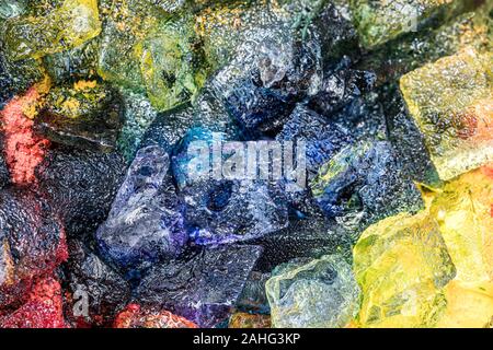 Multicolored ice cubes for ice dyeing art project Stock Photo
