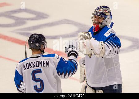 Trinec, Czech Republic. 29th Dec, 2019. L-R Mikko Kokkonen and Kari Piiroinen (both FIN) are seen during the 2020 IIHF World Junior Ice Hockey Championships Group A match between Kazakhstan and Finland in Trinec, Czech Republic, on December 29, 2019. Credit: Vladimir Prycek/CTK Photo/Alamy Live News Stock Photo