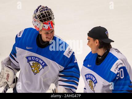 Trinec, Czech Republic. 29th Dec, 2019. L-R Kari Piiroinen and Justus Annunen (both FIN) are seen after the 2020 IIHF World Junior Ice Hockey Championships Group A match between Kazakhstan and Finland in Trinec, Czech Republic, on December 29, 2019. Credit: Vladimir Prycek/CTK Photo/Alamy Live News Stock Photo