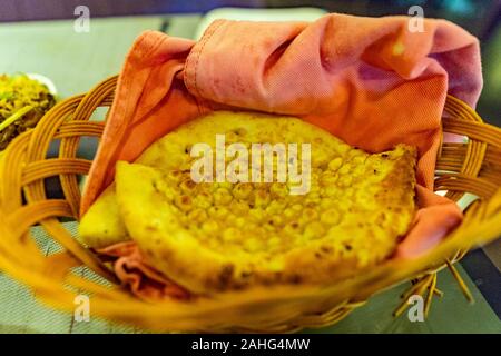 Traditional Mouthwatering Pakistani Garlic Nan Bread in a Basket Closeup View Stock Photo