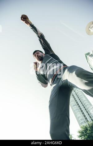 Bottom view of professional boxer putting fist up while training Stock Photo