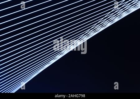 Black an white abstract technology, science or business background. Threads and lines of light intersect and create winding geometric forms in perspec Stock Photo