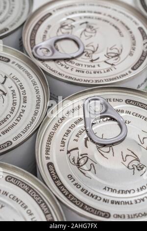 Close-up shot of can opening instructions and ring pull tab on an easy open ASDA tin of pineapple chunks. Metaphor ingenious, easy open food packaging Stock Photo
