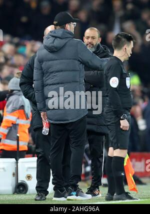 Anfield, Liverpool, Merseyside, UK. 29th Dec, 2019. English Premier League Football, Liverpool versus Wolverhampton Wanderers; Liverpool manager Jurgen Klopp speaks with Wolverhampton Wanderers manager Nuno Espirito Santo during the lengthy VAR review os Sadio Mane of Liverpool's goal - Strictly Editorial Use Only. No use with unauthorized audio, video, data, fixture lists, club/league logos or 'live' services. Online in-match use limited to 120 images, no video emulation. No use in betting, games or single club/league/player publications Credit: Action Plus Sports/Alamy Live News Stock Photo