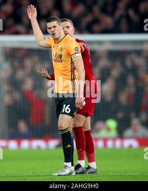 Wolverhampton Wanderers' Conor Coady (front) and Liverpool's Jordan Henderson exchange words after VAR disallows Pedro Neto's goal during the Premier League match at Anfield Stadium, Liverpool. Stock Photo