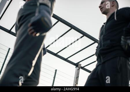 Blurred image of the boxer standing opposite his trainer Stock Photo