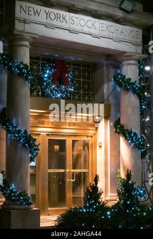 The New York Stock Exchange is festively decorated with lights and garlands during the holiday season, NYC, USA Stock Photo