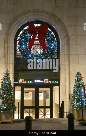 The New York Stock Exchange is festively decorated with lights and garlands during the holiday season, NYC, USA Stock Photo