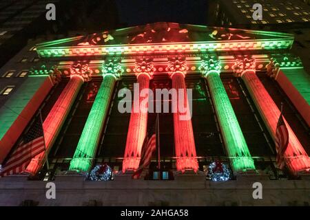The New York Stock Exchange is festively decorated with lights and garlands during the holiday season, NYC, USA Stock Photo