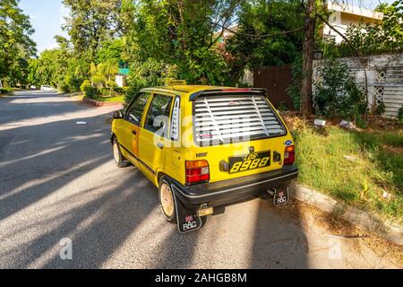 Islamabad Yellow Colored Small Taxi Car Picturesque Breathtaking View at Sunny Blue Sky Day Stock Photo