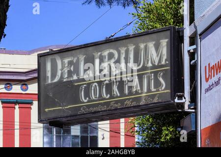 Delirium Cocktails bar neon sign in Mission District of San Francisco, United States of America. Service for the Sick. Stock Photo