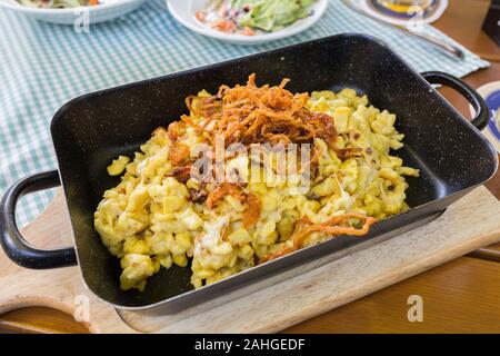 Close up of traditional swabian Käsespätzle (cheese noodles) - a popular dish in Southern Germany. The main ingredients are eggs, milk, flour & cheese Stock Photo