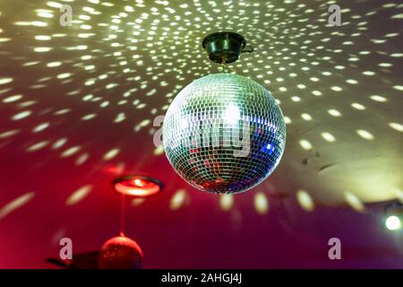 Disco ball with bright rays, night party background photo Stock Photo