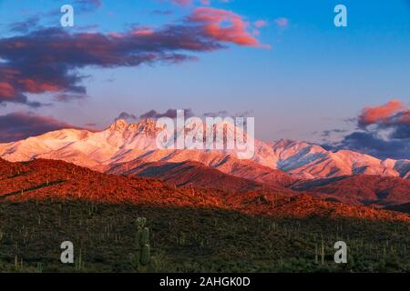 Sunset Image of the Snow covred Four Peaks Mountain Range Outside Phoenix AZ after storm Stock Photo