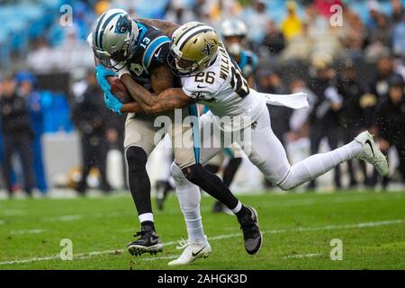 New Orleans Saints cornerback P.J. Williams (26) runs with the ball after  an interception during the first half of an NFL football game against the  New England Patriots, Sunday, Sept. 26, 2021