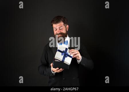 Not for sale. Happy boss hold present box dark background. Happy man getting gift. Happy holidays. Happy birthday. Holiday celebration. Boxing day. Stock Photo