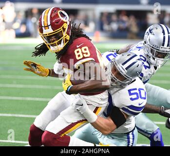 Arlington, United States. 29th Dec, 2019. Dallas Cowboys outside linebacker Sean Lee (50) wraps up Washington Redskins wide receiver Cam Sims (89) during their NFL game at AT&T Stadium in Arlington, Texas on Sunday, December 29, 2019. Photo by Ian Halperin/UPI Credit: UPI/Alamy Live News Stock Photo
