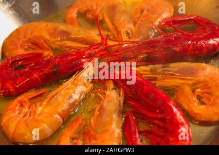 Close-up of a paella in which crustaceans, prawns, reds are being fried Stock Photo
