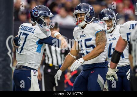 Houston, Texas, USA. 29th Dec, 2019. Tennessee Titans tight end MyCole  Pruitt (85) carries the ball upfield after a catch while Houston Texans  safety Jahleel Addae (37) defends during the third quarter