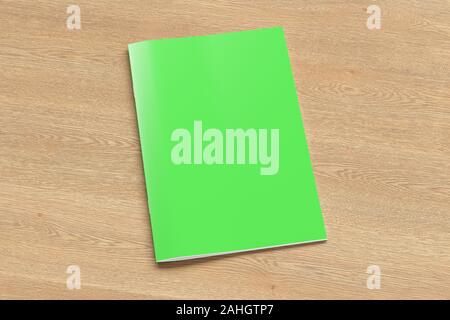 Green brochure or booklet cover mock up on wooden background. Isolated with clipping path around brochure. Side view. 3d illustratuion Stock Photo