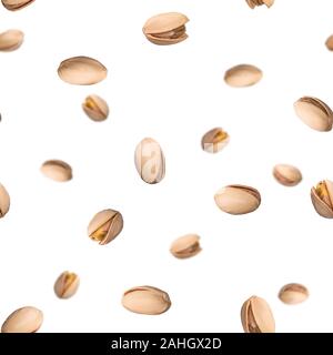 Seamless pattern with falling pistachio nuts isolated on white background. Levity kernels. Stock Photo