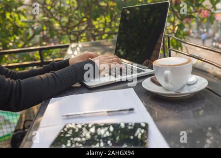 Freelancer woman hands using laptop Stock Photo