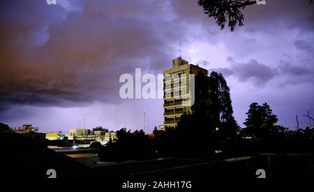 dramatic skyline, the light hole between a dark storm clouds Stock Photo