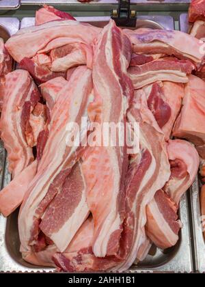 Pile of pork belly slices for sale in hypermarket Stock Photo