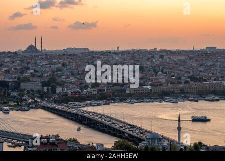 Historical Istanbul ferries. Ariel view during amazing sunset Halic Bridge Stock Photo