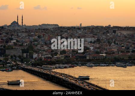 Historical Istanbul ferries. Ariel view during amazing sunset Halic Bridge Stock Photo