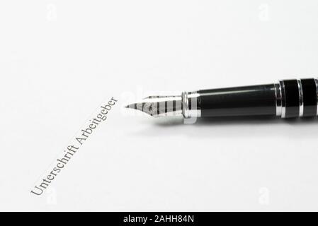 Employment contract in Germany, pen and signature Stock Photo