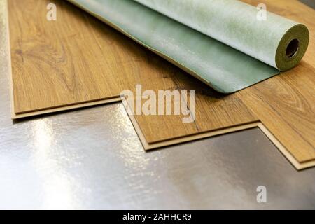 laminate floor installation in a room on foil underlay Stock Photo - Alamy