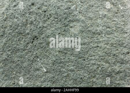 Background of stones on the black ground of Lava of a Etna Volcano Stock Photo