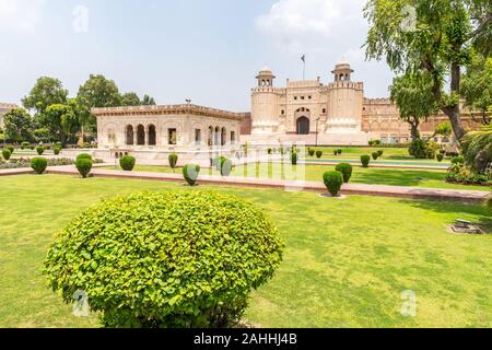 Lahore Fort Picturesque Breathtaking View of Hazuri Bagh Park and Alamgiri Gate with Waving Pakistan Flag on a Sunny Blue Sky Day Stock Photo