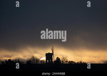 The sun rises over Chesterton Windmill, in Warwickshire. Stock Photo