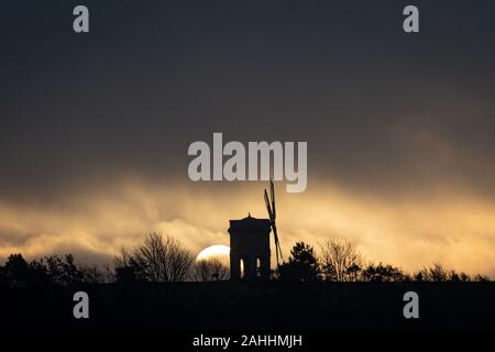 The sun rises over Chesterton Windmill, in Warwickshire. Stock Photo
