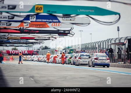 Buriram, Thailand - 28 June 2019 : Chang SuperGT race match, perfomance car round prepare to go into stadium on the pit stop, with some race marshall Stock Photo