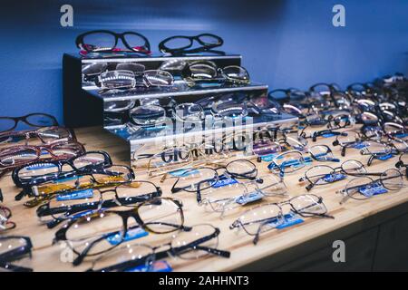 Phuket, Thailand - 10 December 2018 : many design and many brand of glasses for gentlemen and ladies are sort on the shelves beautifully Stock Photo
