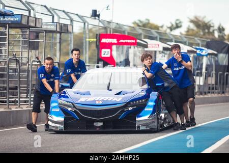 Buriram, Thailand - 28 June 2019 : Chang SuperGT race match, One of Japanese team - Keehin, pushing their racing car team together Stock Photo