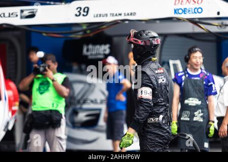 Buriram, Thailand - 28 June 2019 : Thailand SuperGT racing match, Japanese driver from some team have to practice changing wheels by their own too Stock Photo