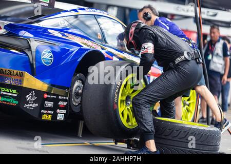Buriram, Thailand - 28 June 2019 : Thailand SuperGT racing match, Japanese driver from some team have to practice changing wheels by their own too at Stock Photo