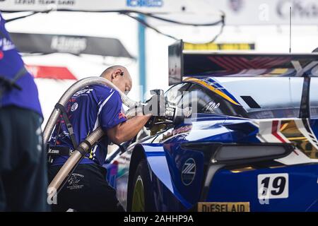 Buriram, Thailand - 28 June 2019 : Thailand SuperGT racing match, One of Japanese team still preparing their team racing car, fill fuel or gas to the Stock Photo
