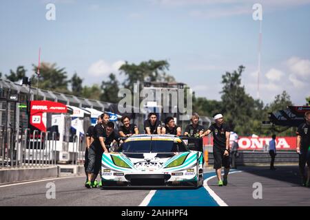 Buriram, Thailand - 28 June 2019 : Thailand SuperGT racing match, One of Japanese team - Teddy, pushing their own racing car together on the pit walk Stock Photo