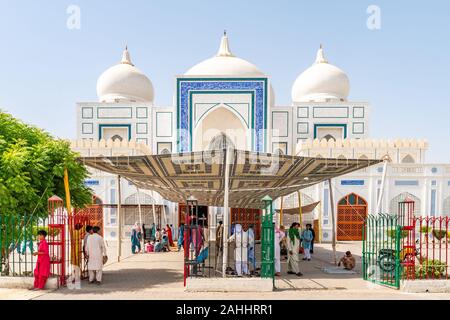 Larkana Bhutto Family Mausoleum Picturesque View with Visitors Entering and Exiting the Shrine on a Sunny Blue Sky Day Stock Photo