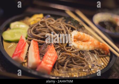 Soba with sea food, cold noodle from Japan serve with crab and shimp meat eating with miso soup Stock Photo